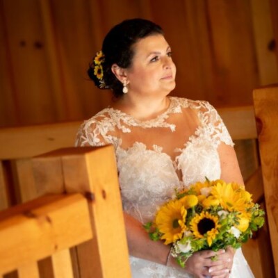 Complete your bridal ensemble with Close-up of bride’s delicate accessories and classic makeup.