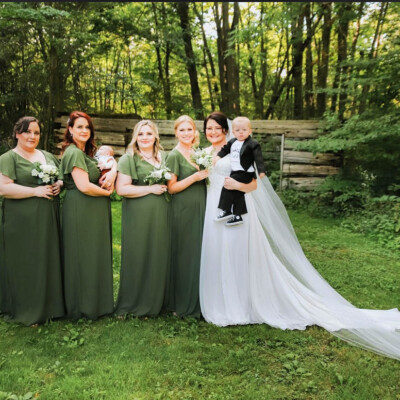 Beauty by Krimse specializes in soft wave bridal hairstyles Bridal hairstyle featuring soft waves and a hair accessory.