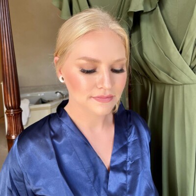 Beauty by Krimse creates striking bridal makeup Bridal makeup with a bold red lip and defined eyes.