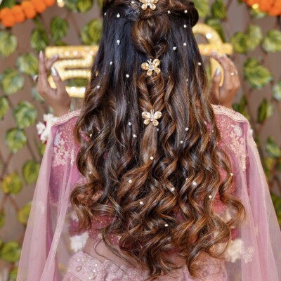 Beauty by Krimse offers semi-bridal hairstyling services with a blend of modern and luxurious touches. Semi-bridal hairstyle with modern and luxurious touches.