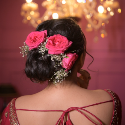 Showcasing an elegant and modern bridal hairstyle crafted by Beauty by Krimse, perfect for Western and South Asian bridal styles. Elegant bridal hairstyle with modern and luxurious design.