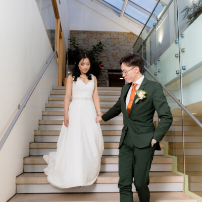 Beauty by Krimse specializes in romantic hairstyles that pair Bride adjusting her veil, emphasizing a romantic hairstyle.