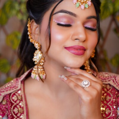 Beauty by Krimse offers South Asian bridal hairstyles featuring intricate braids and opulent accessories to complete your look. Traditional South Asian bridal hairstyle featuring intricate braids and accessories.