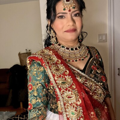 Beauty by Krimse specializes in traditional South Asian bridal hairstyling with ornate and detailed designs. Traditional South Asian bridal hairstyle with intricate ornamentation.
