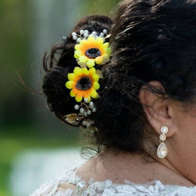 A sleek and modern Western bridal hairstyle crafted by Beauty by Krimse for an elegant wedding day look. Western bridal hairstyle with a sleek and modern finish.
