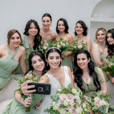 Beauty by Krimse creates classic bridal styles that radiate Bride and groom walking hand in hand, showcasing a timeless bridal look.